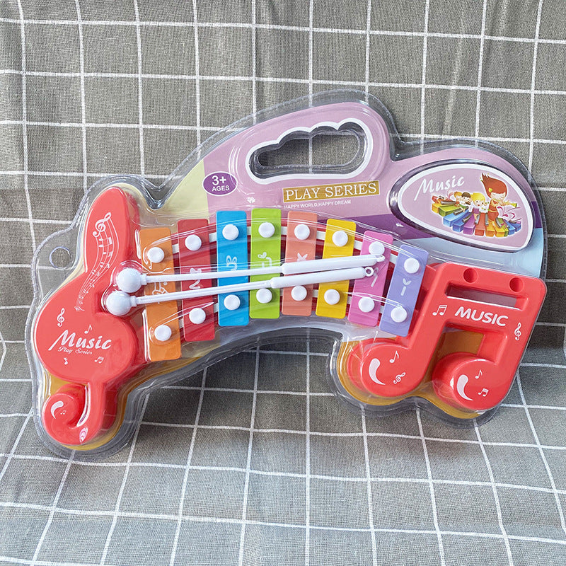 Children Hand Knocks Xylophone Music Note Shape