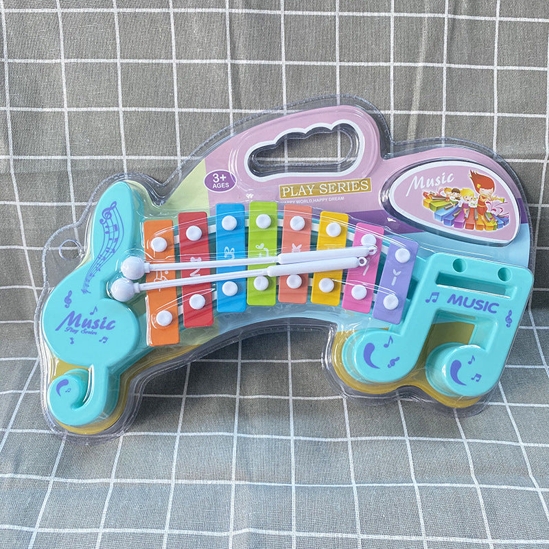 Children Hand Knocks Xylophone Music Note Shape